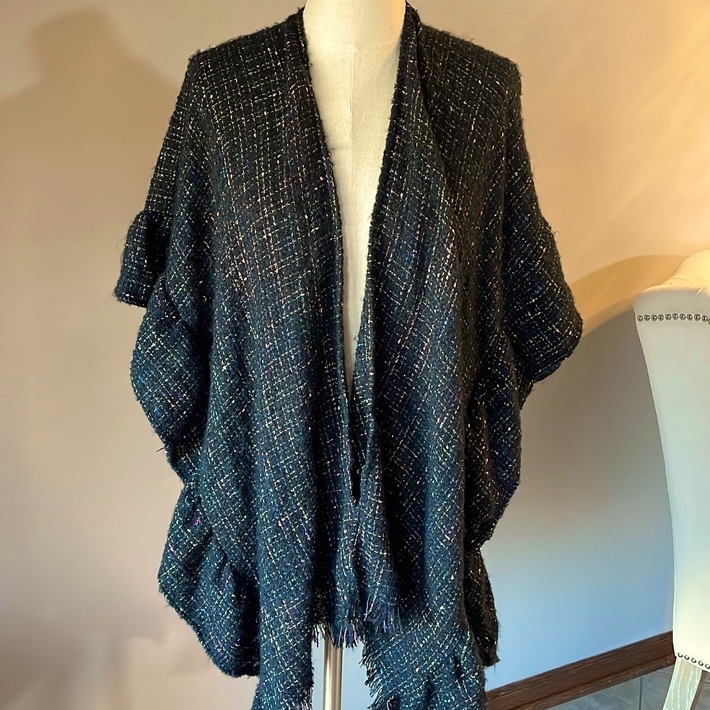 Cape / shawl sleeved ruffled longer length knit sweater has silver shine thread